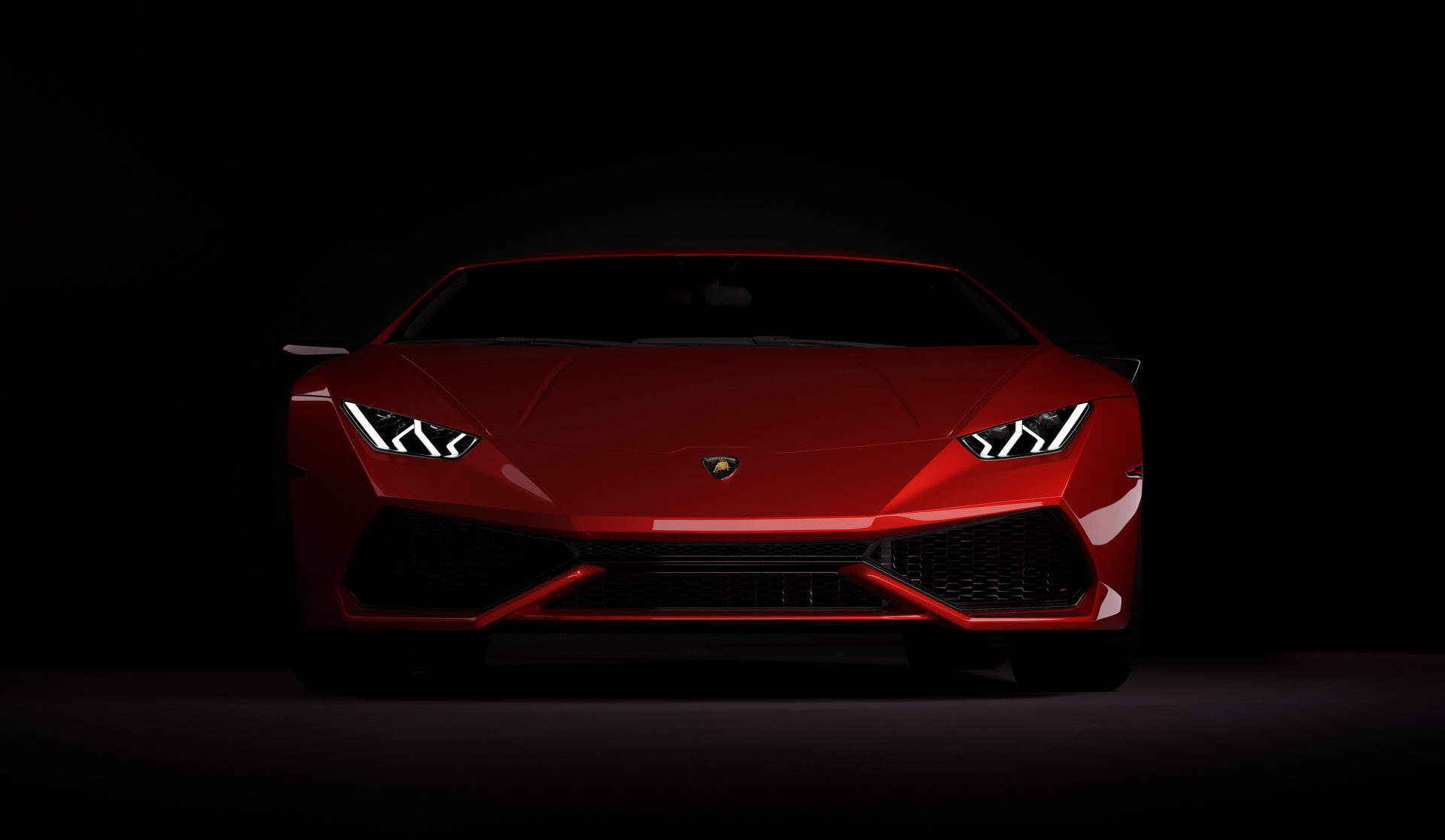 Red Lamborghini Huracán in a dark studio